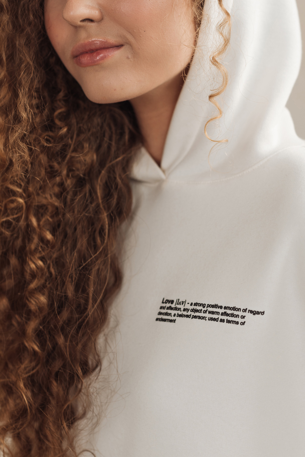 White sweatshirt with a slogan