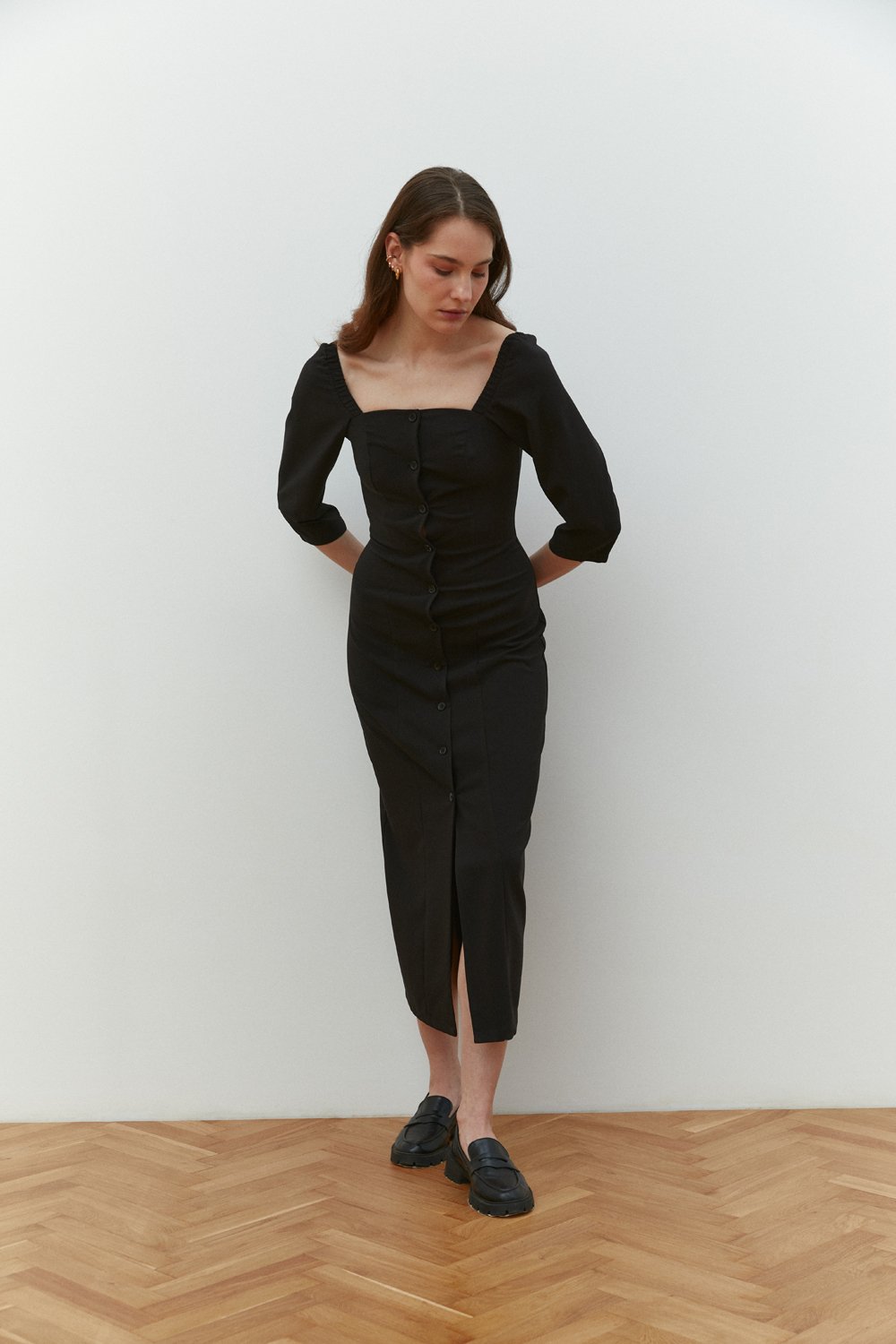 Black fitted midi dress with square neckline