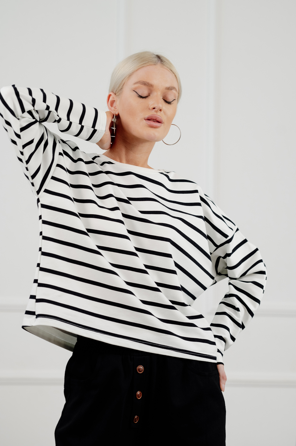 Black cropped sweatshirt with striped print.
