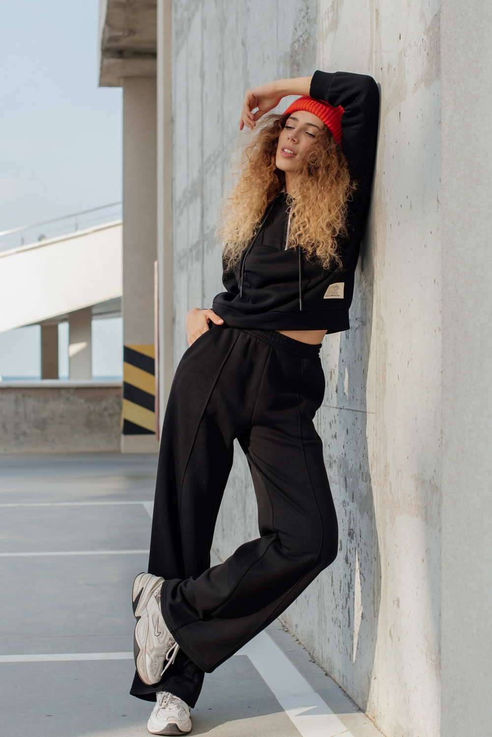 Warm black flared trousers with arrows