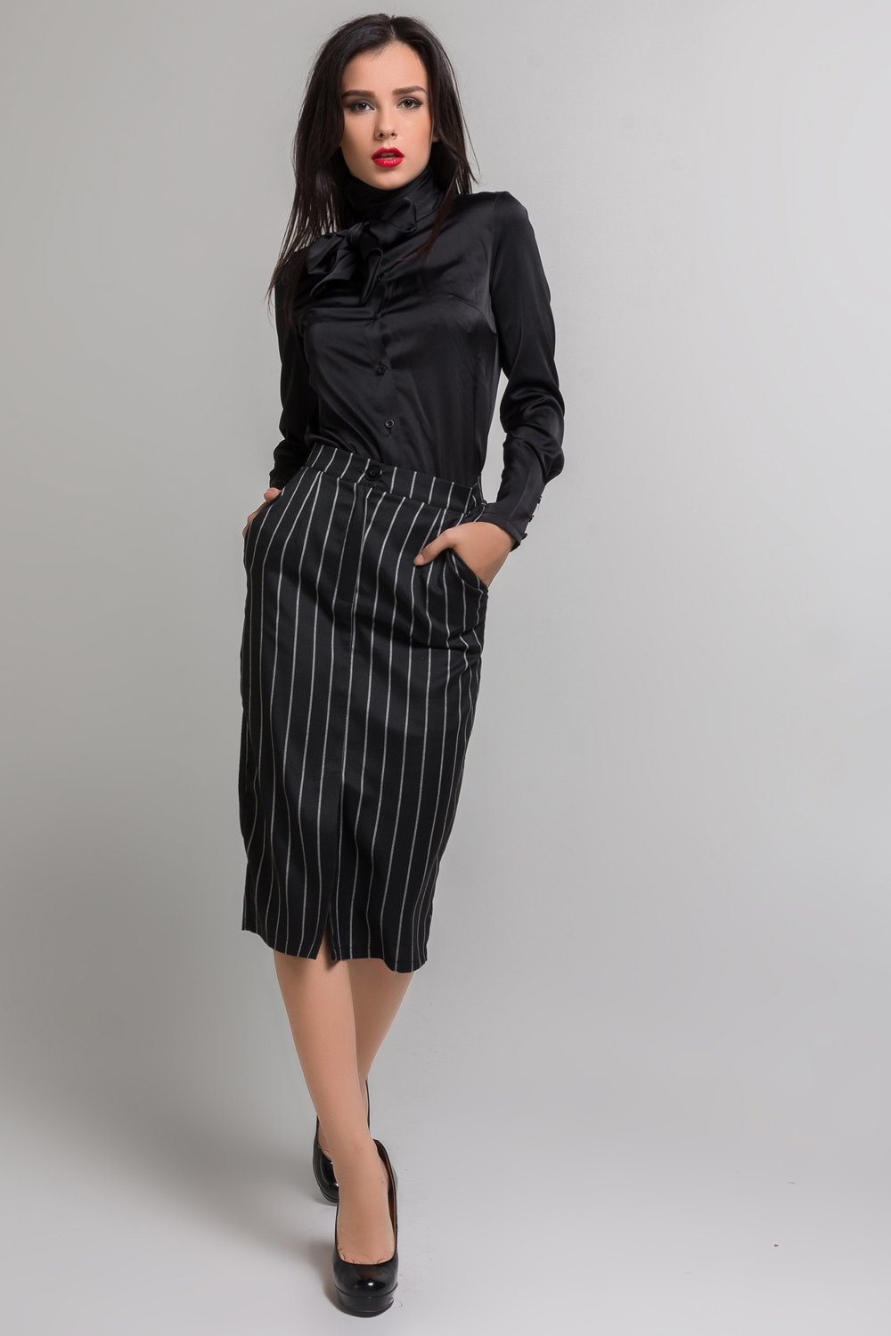Striped midi skirt with pockets and front cutout.