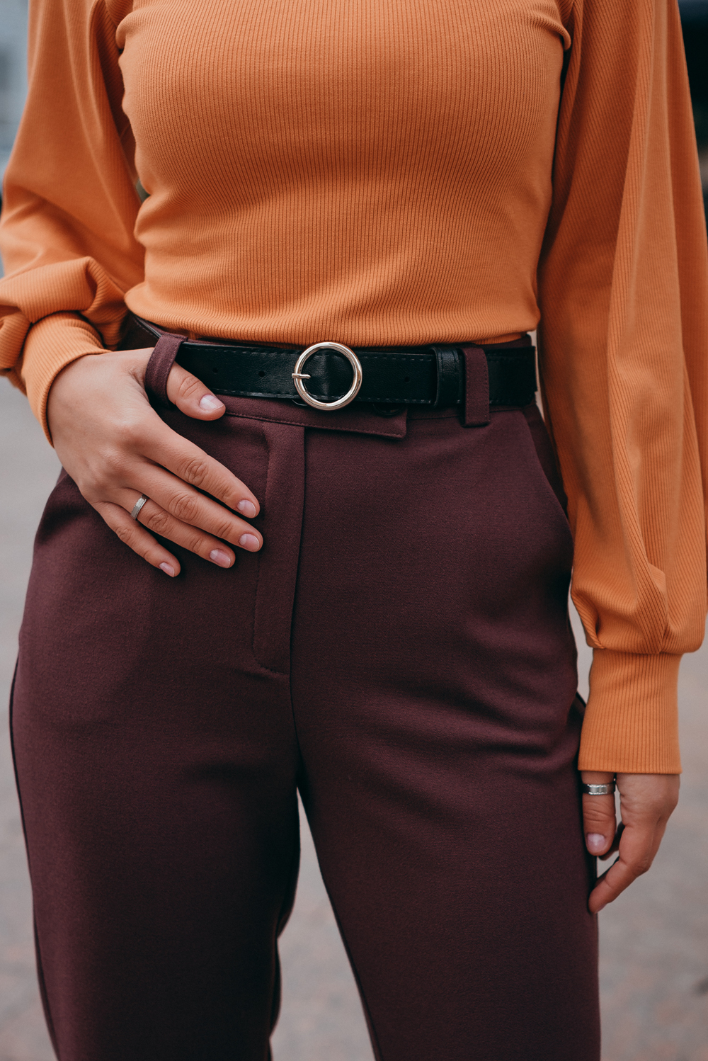 Trousers with beveled waistband and buttons