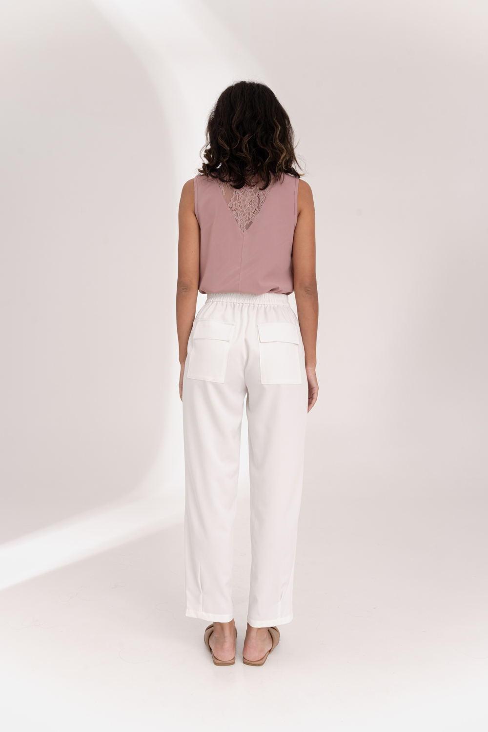 Milk trousers with an elasticated waistband and pleats at the bottom