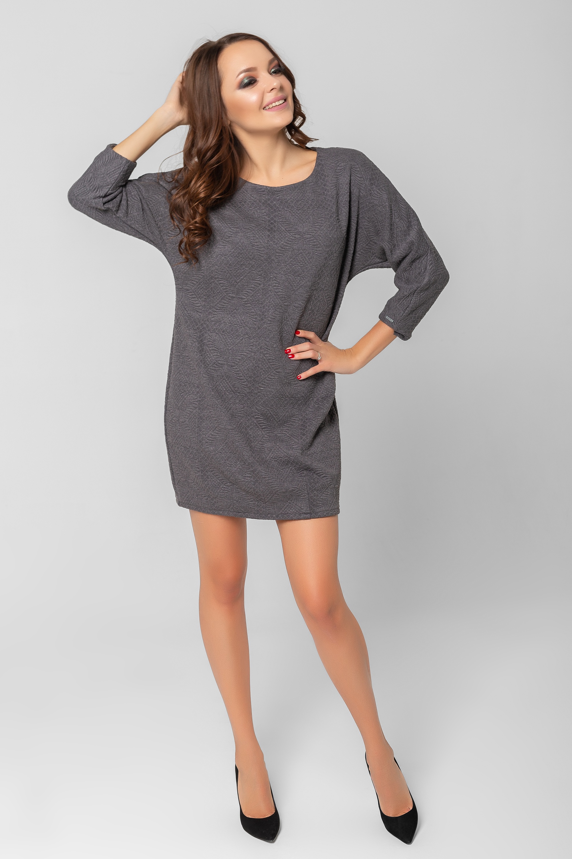 Textured dress with a batwing sleeve.