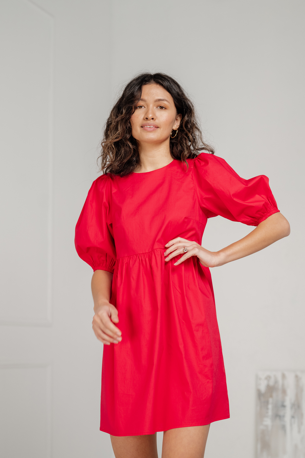 Red cotton mini dress with loose skirt.