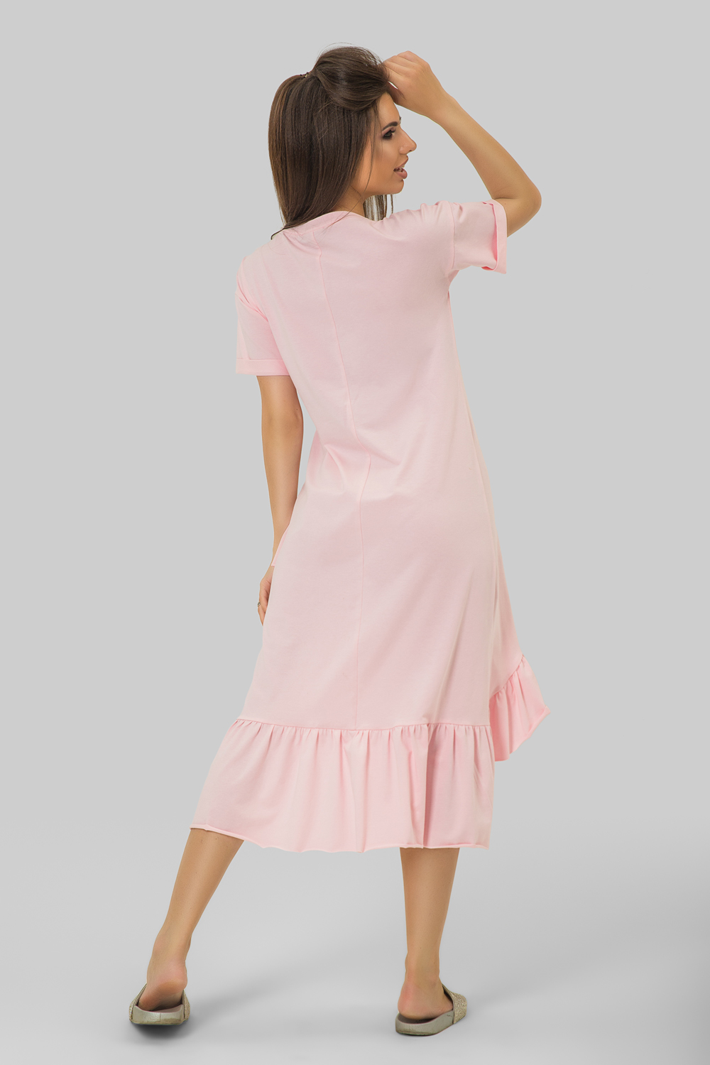 Pink knitted dress with ruffle at the bottom