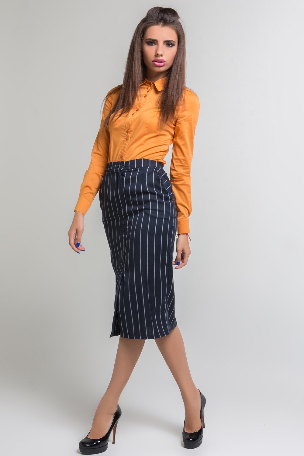 Midi length striped skirt with pockets and front cutout.