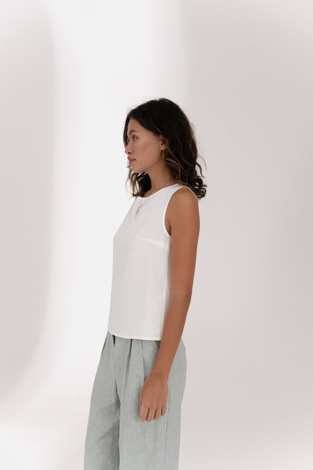 Milky sleeveless top with lace insert on the back