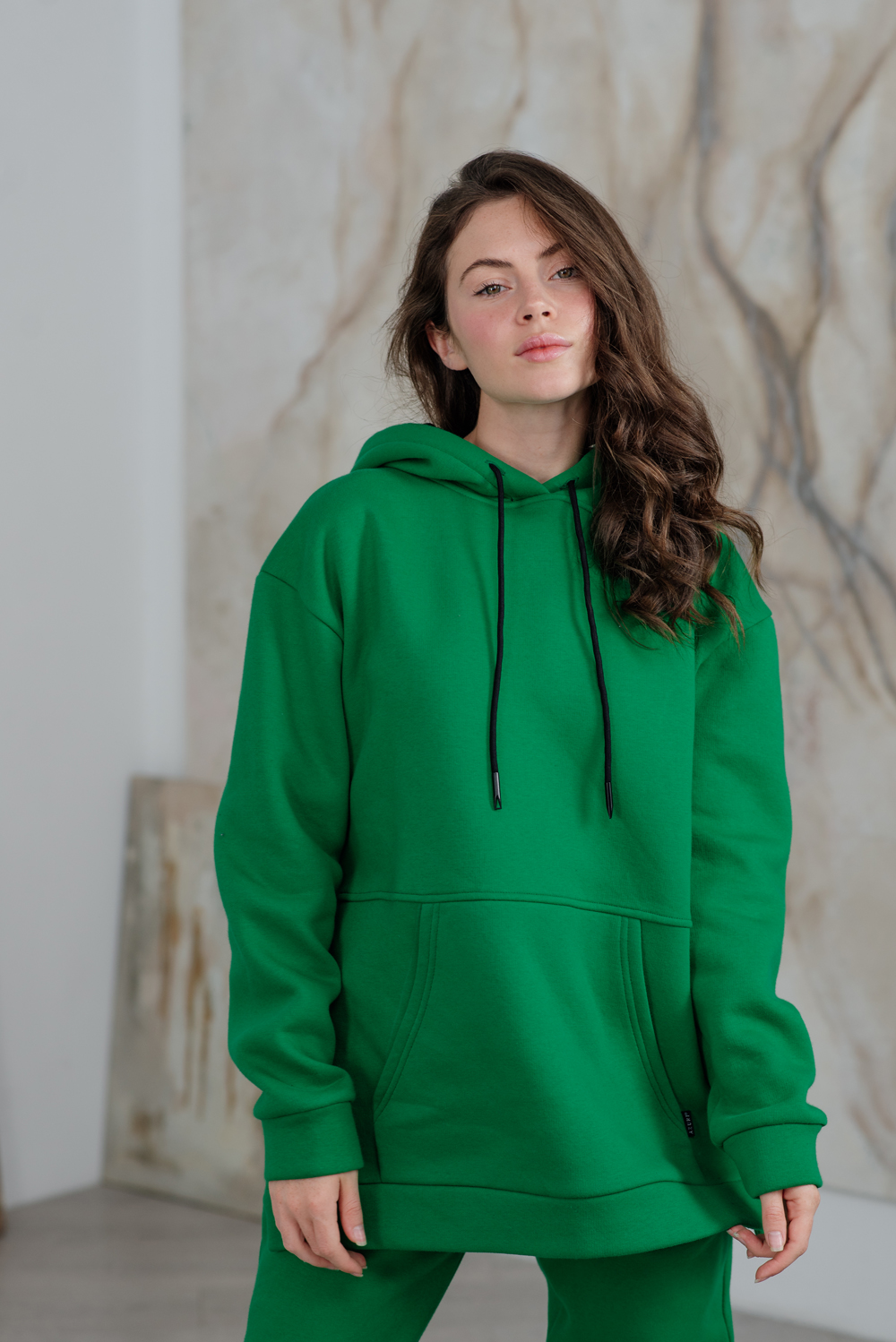Green sweatshirt with a hood