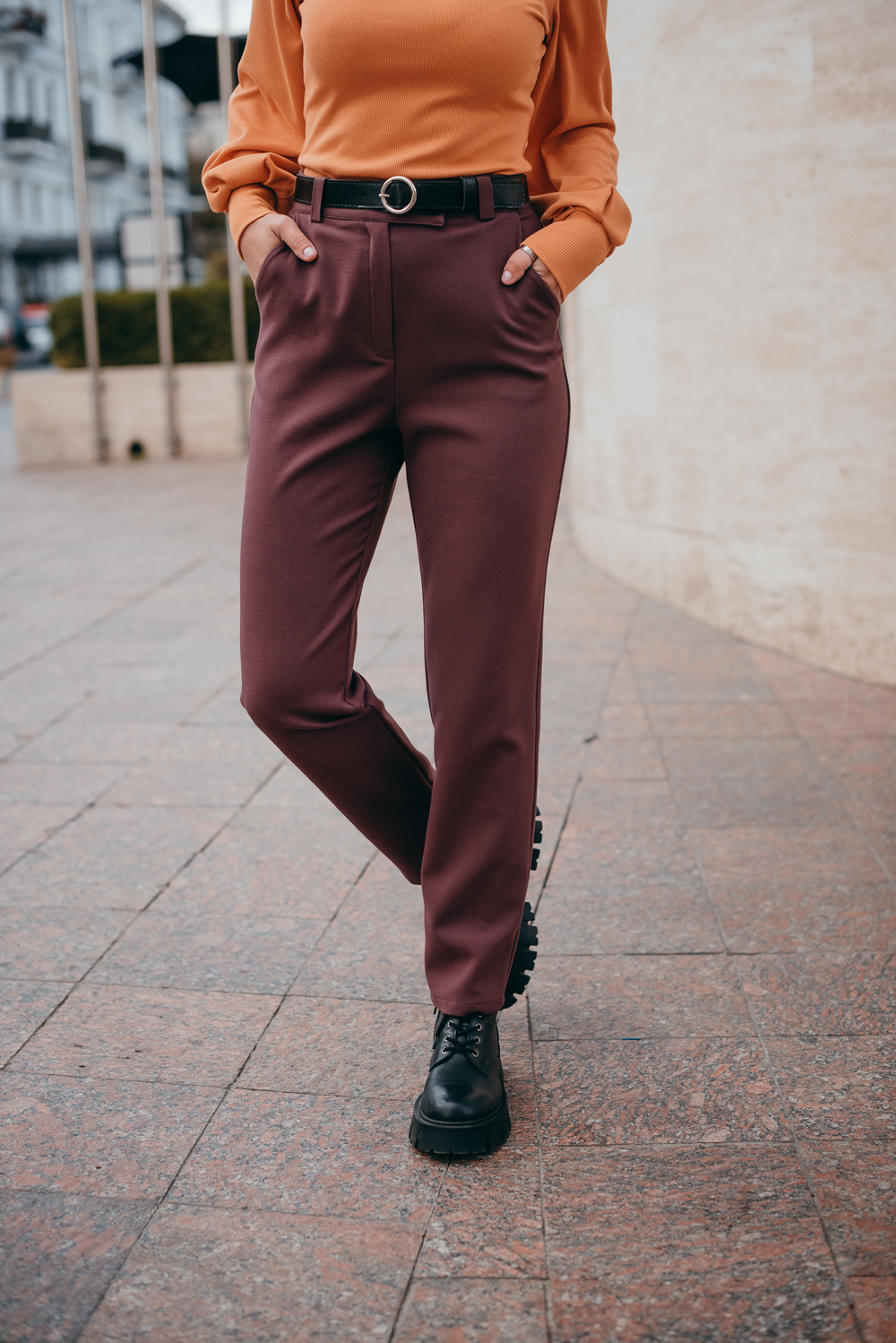 Trousers with beveled waistband and buttons