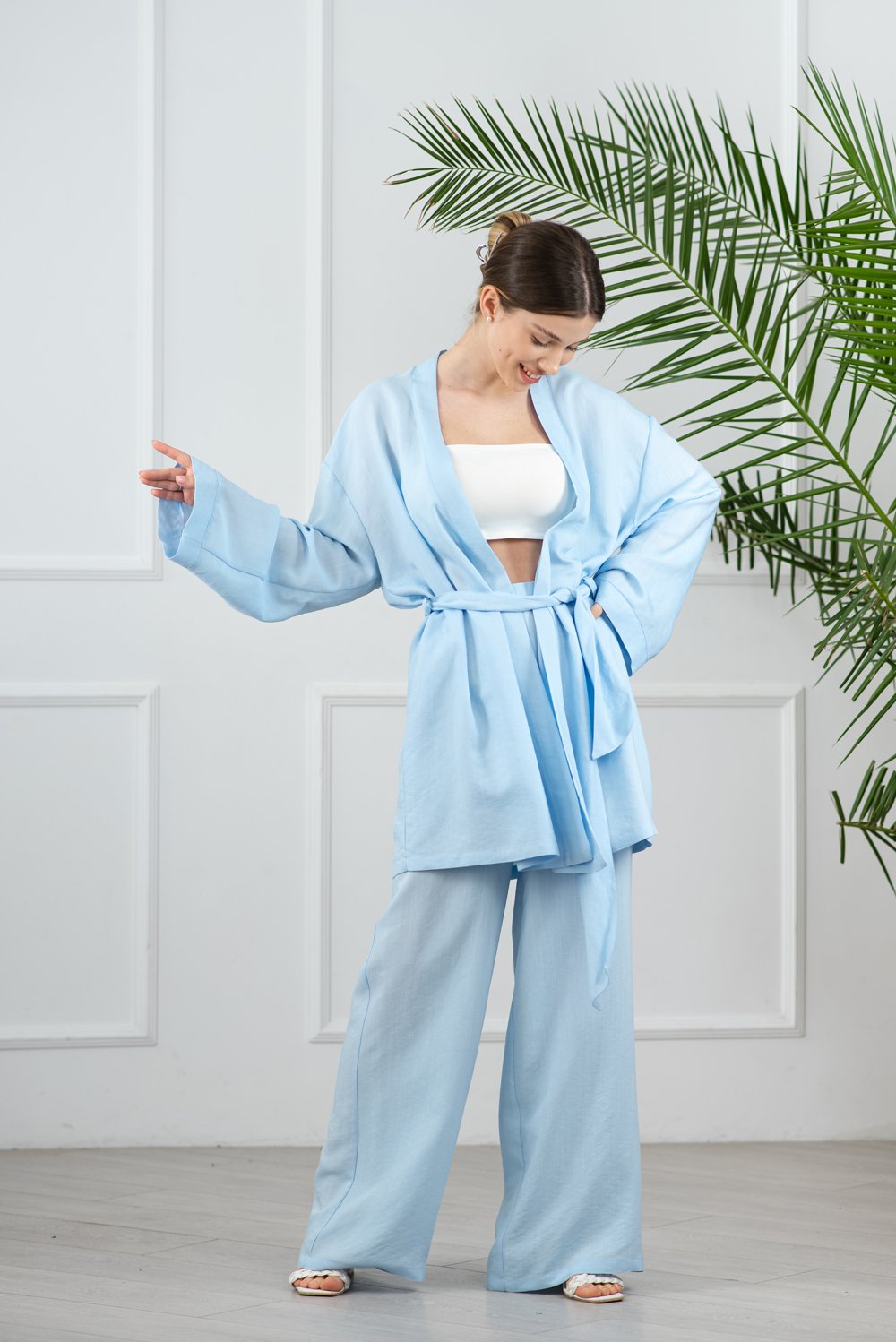 Blue kimono suit with flared pants.