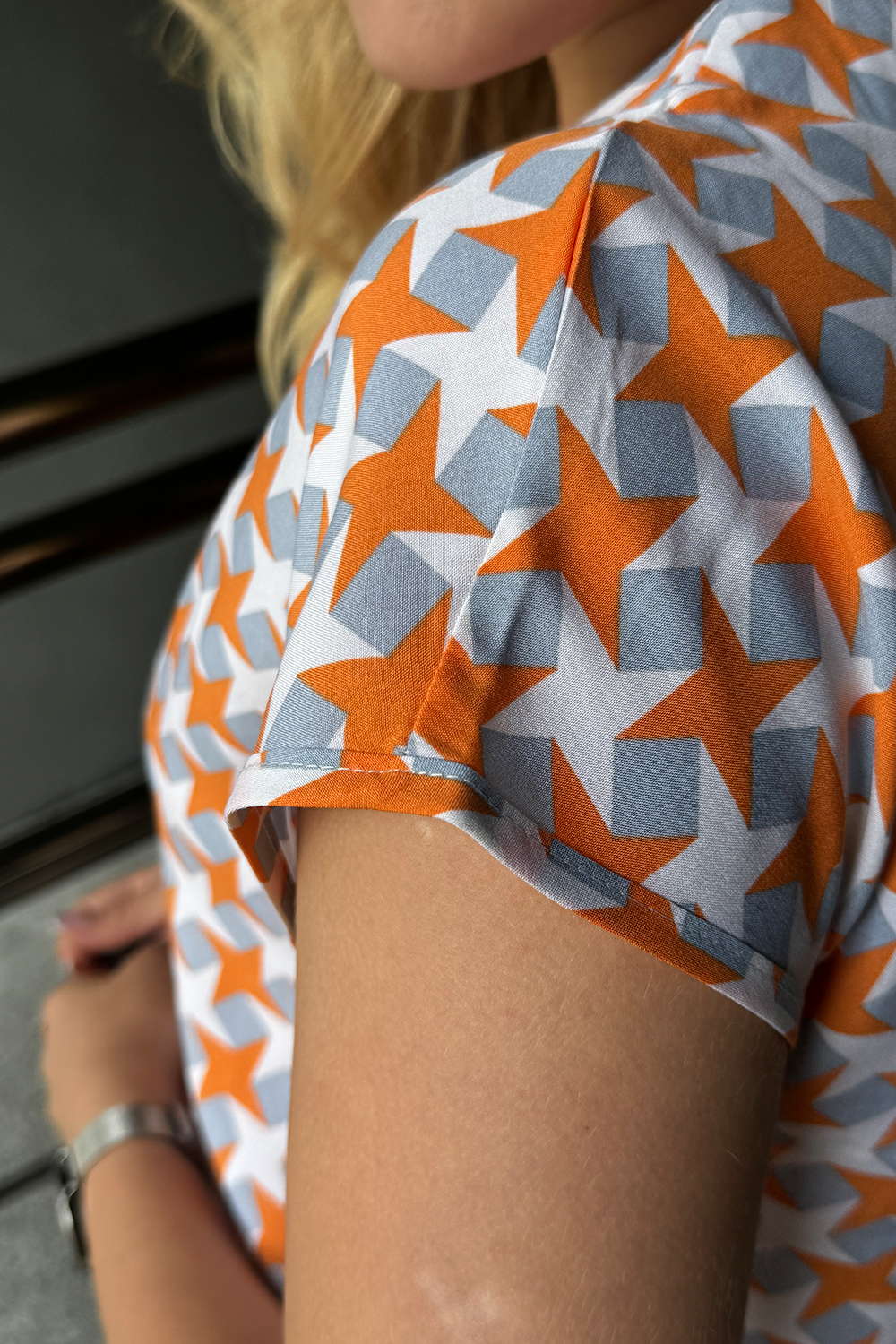Lightweight orange staple blouse