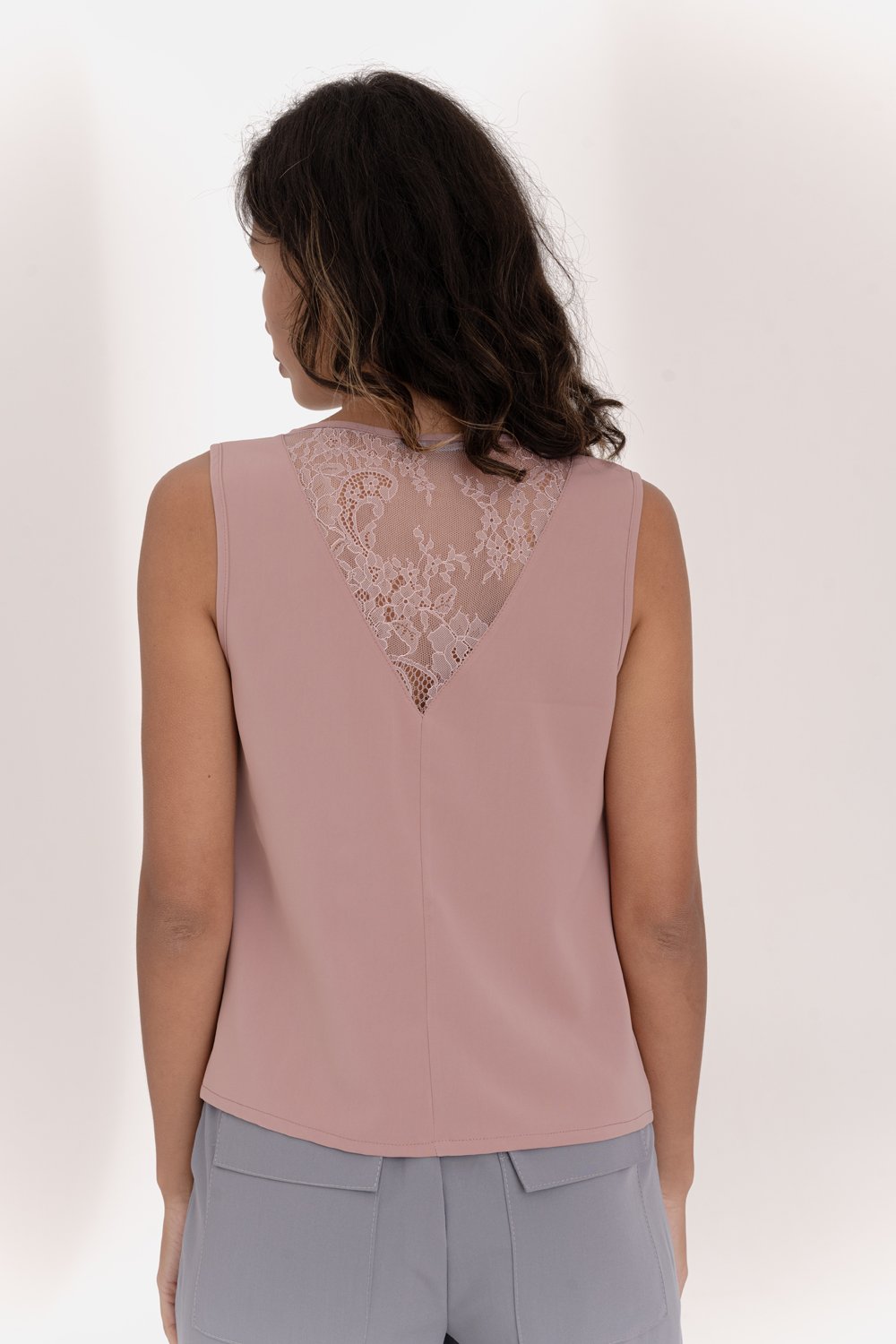 Pink sleeveless top with lace insert on the back