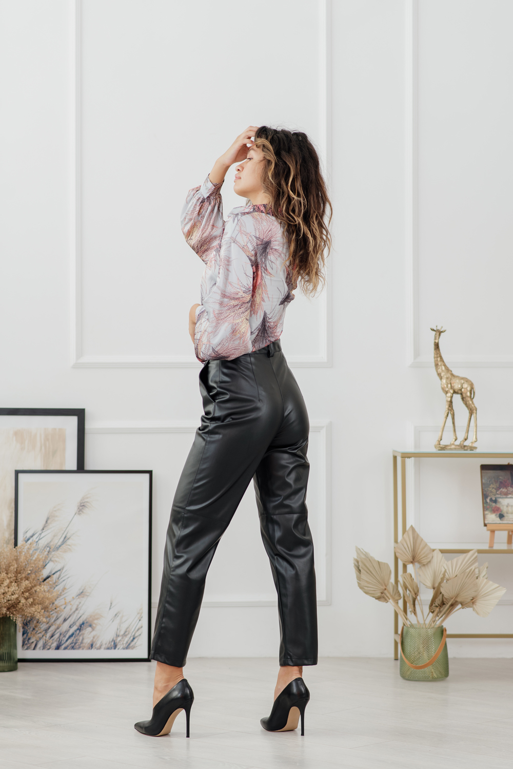 Black loose trousers made of eco leather