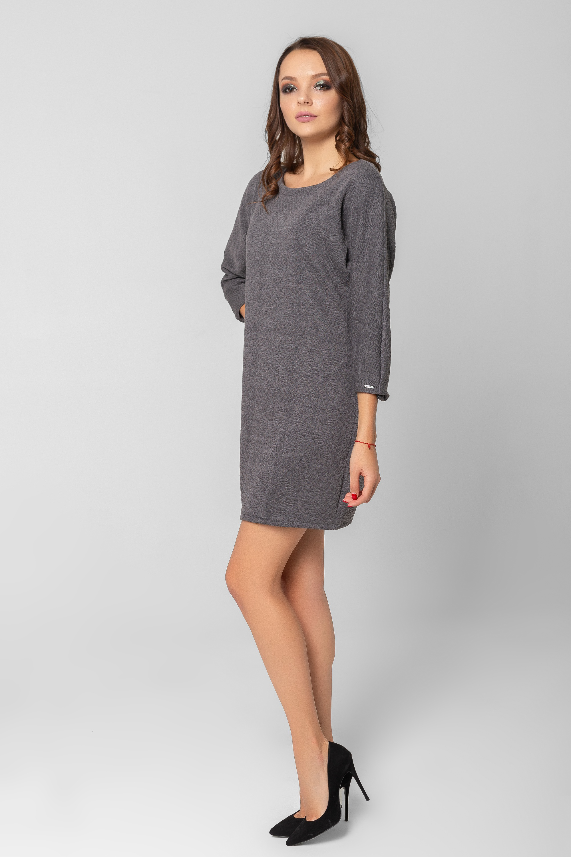 Textured dress with a batwing sleeve.