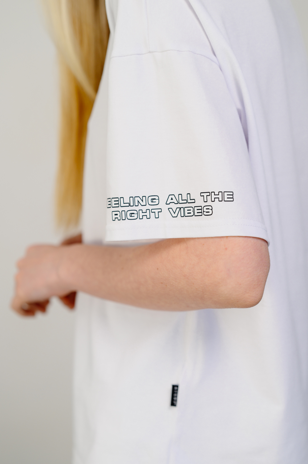 Oversized white T-shirt with sticker