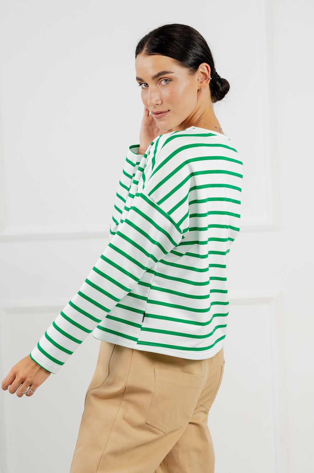 Green cropped sweatshirt with stripes.