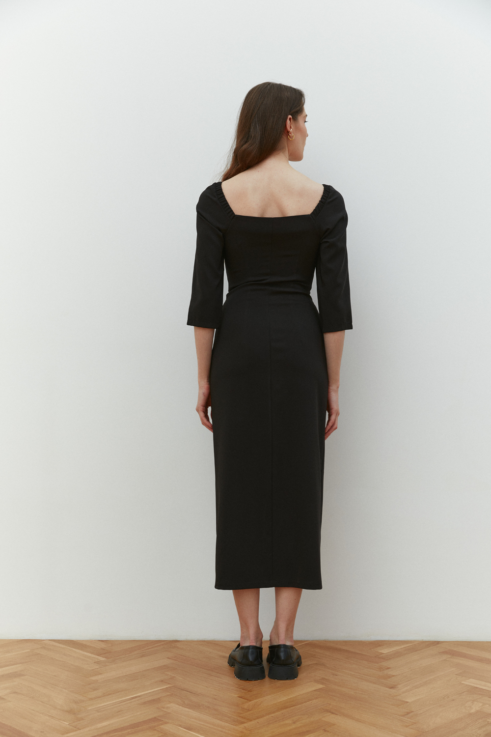 Black fitted midi dress with square neckline