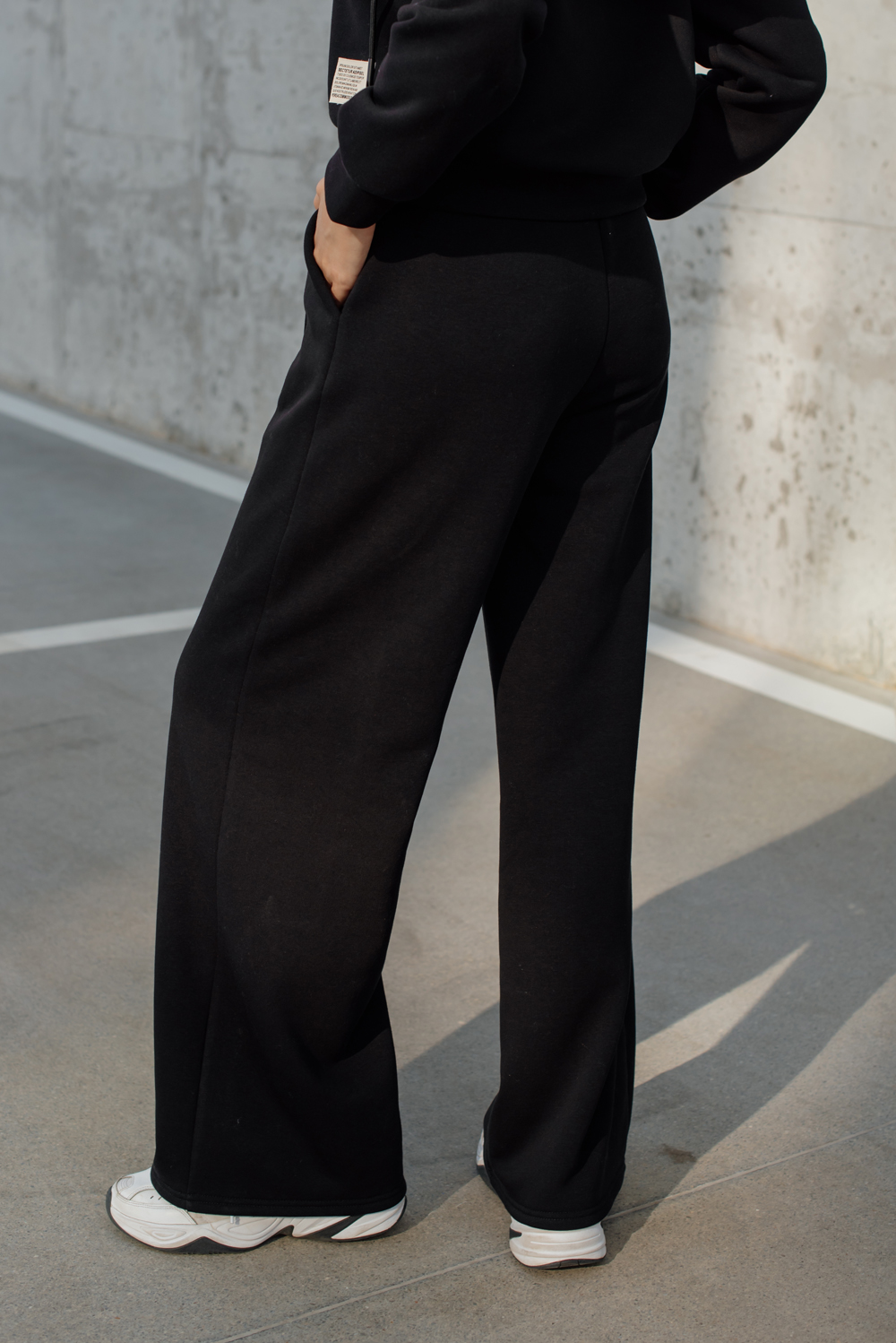 Warm black flared trousers with arrows