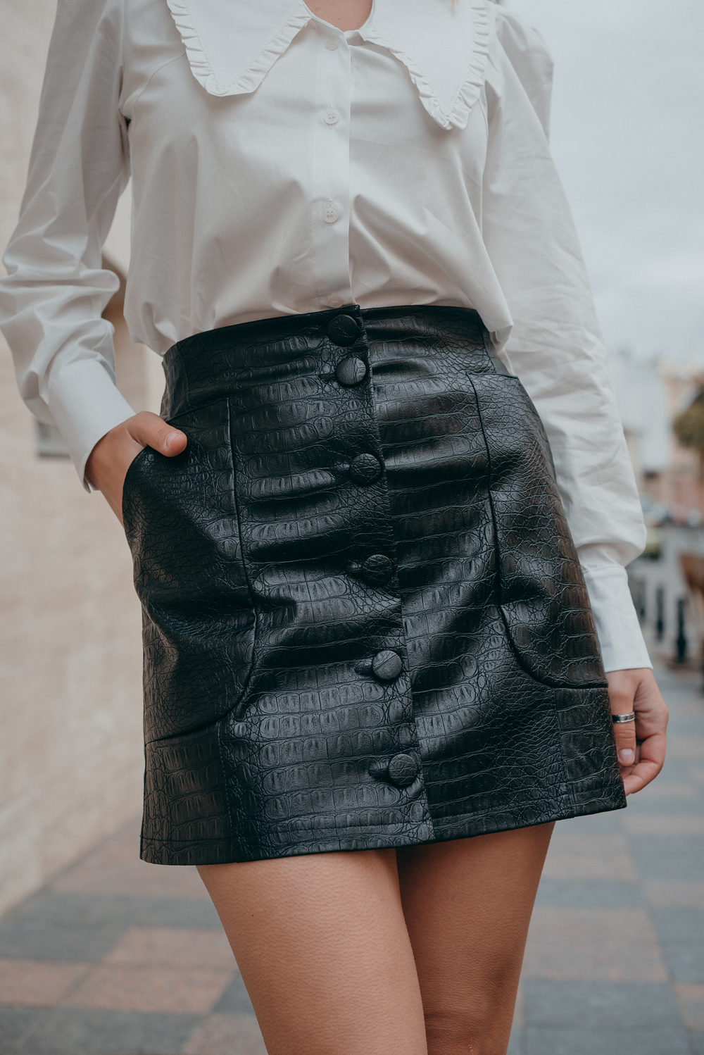 Black eco leather mini skirt with buttons