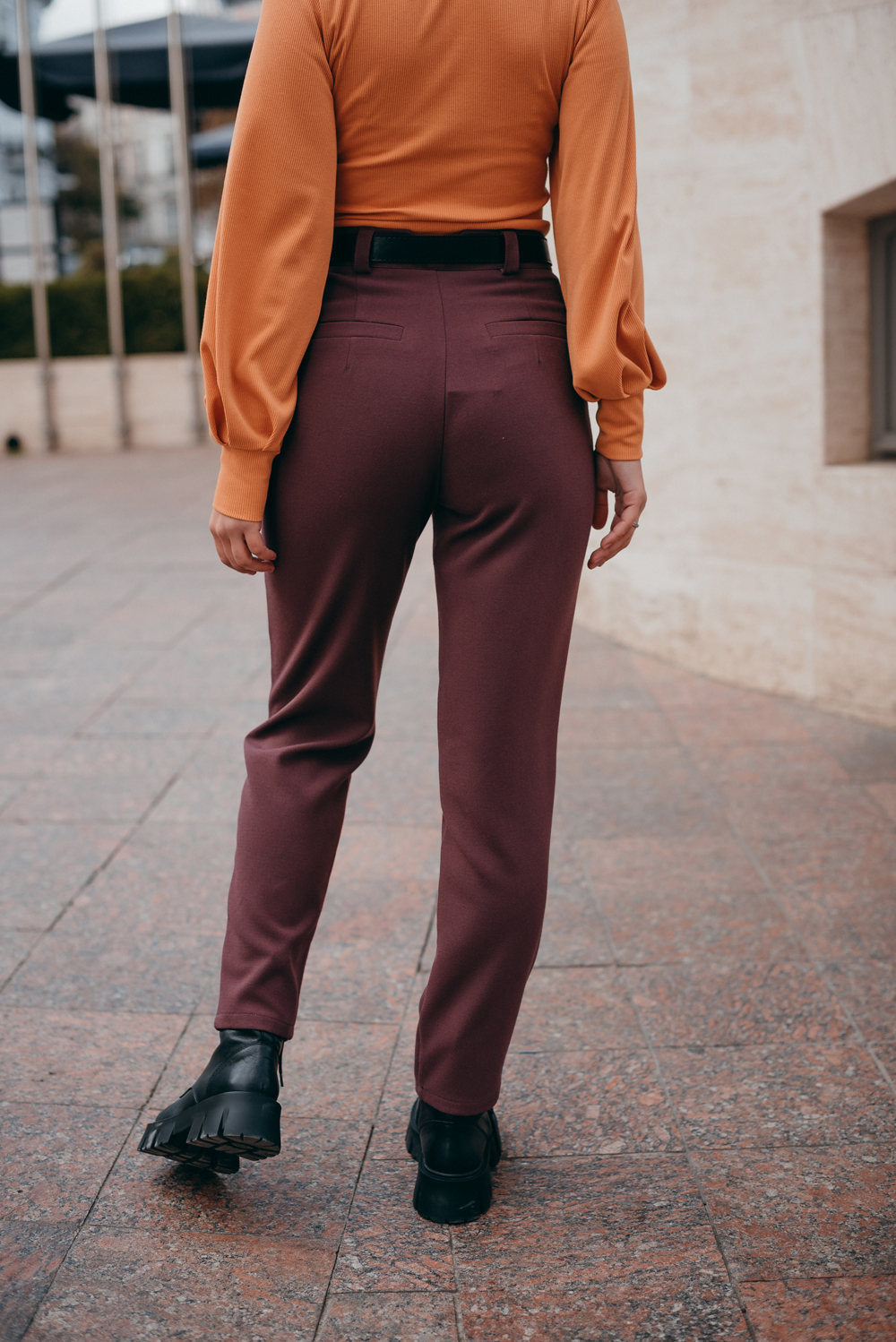 Trousers with beveled waistband and buttons