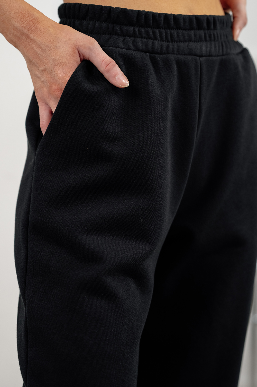 Black sweatpants with a loose fit
