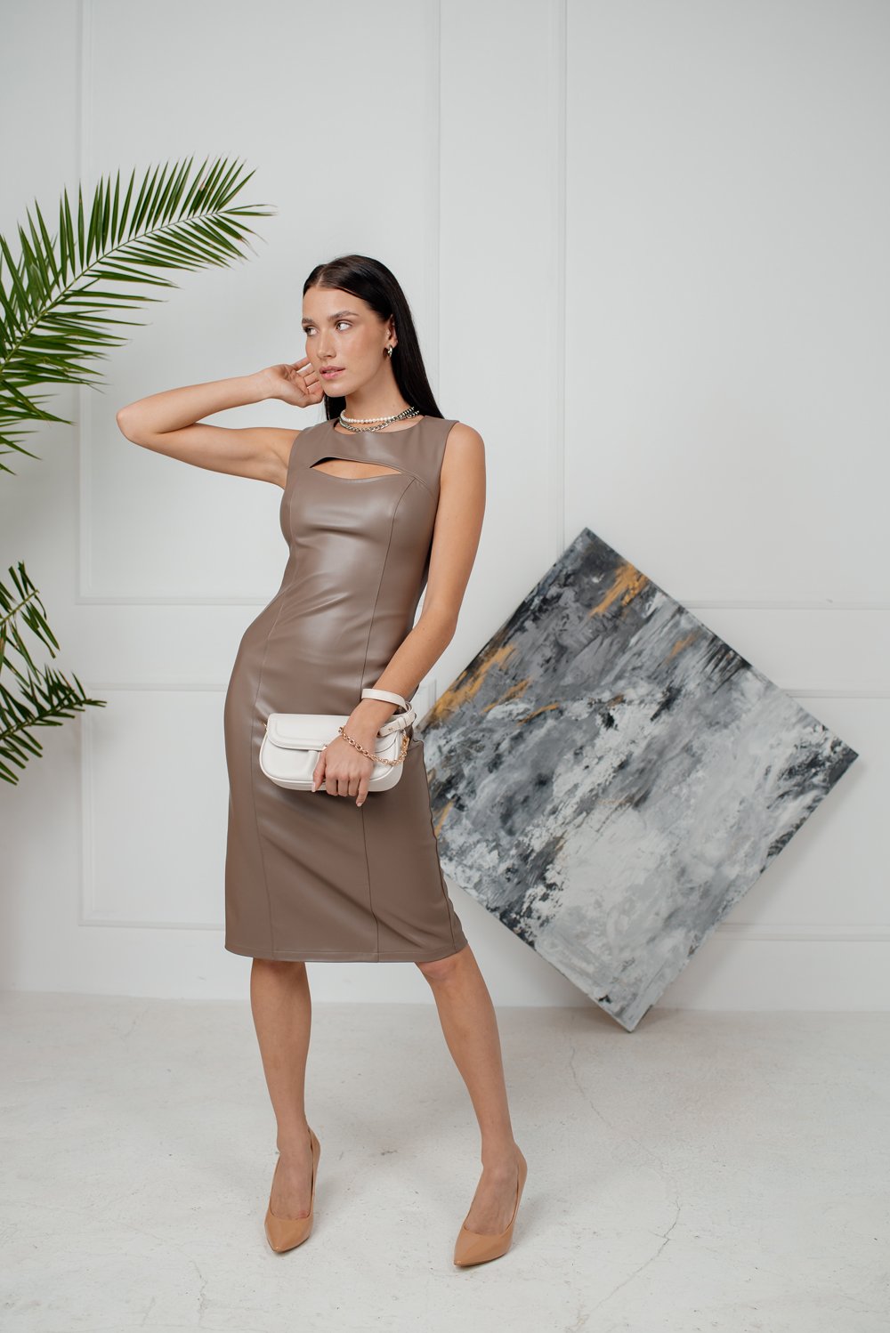 Sheath dress made of eco leather with a cutout and a zipper
