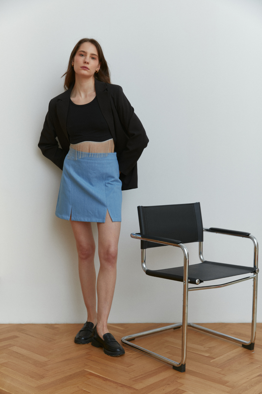 Light blue denim miniskirt with elegant front slits
