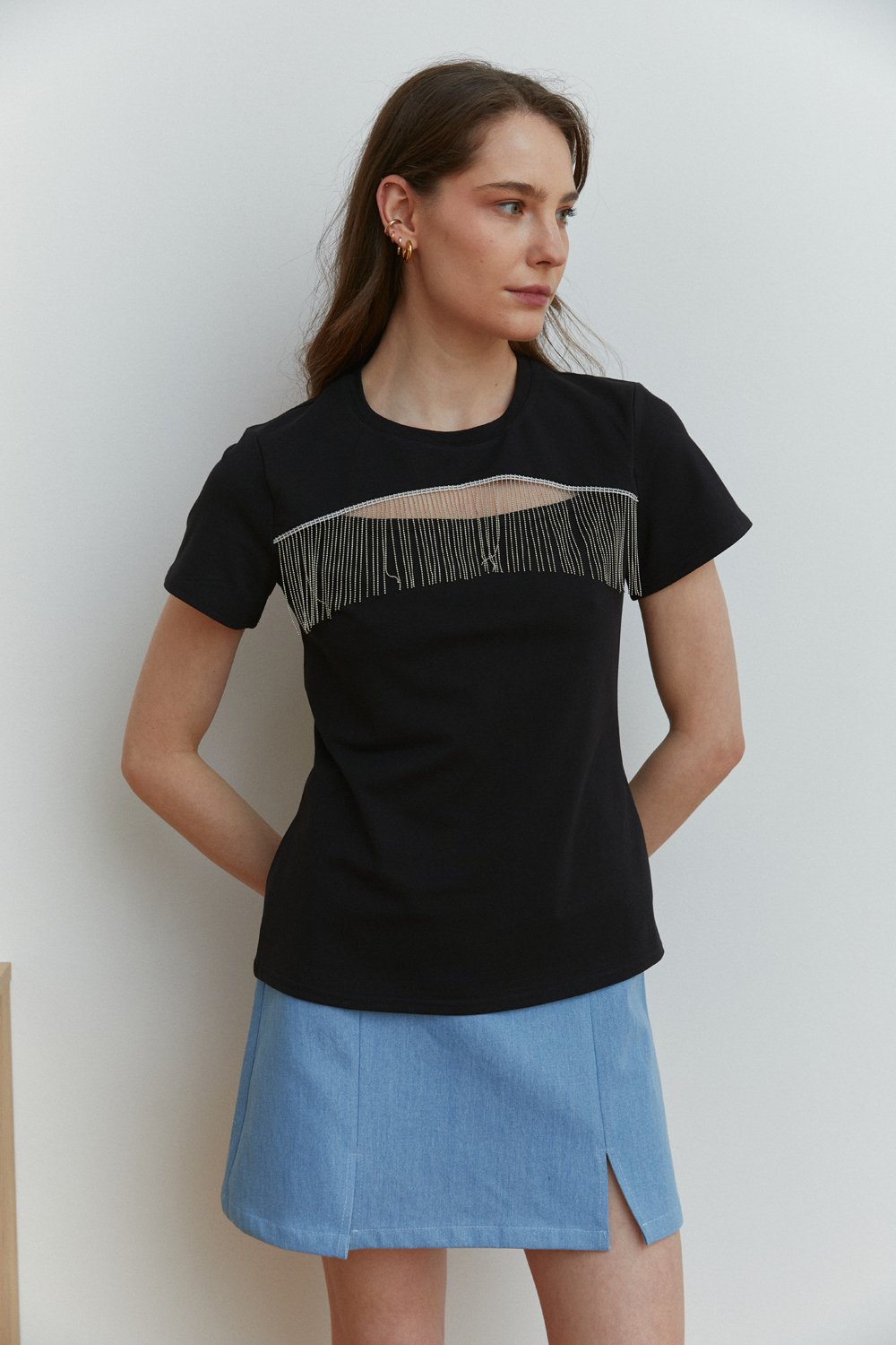 Black T-shirt with cut-out chest decorated with fringed silver beads