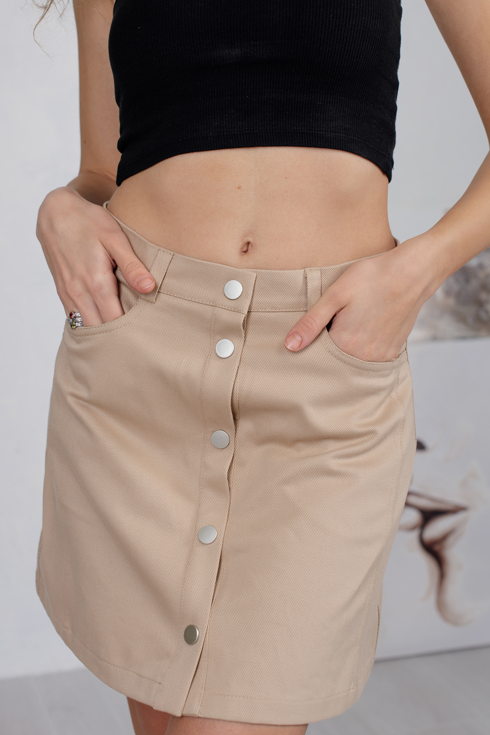 Beige mini skirt with pockets