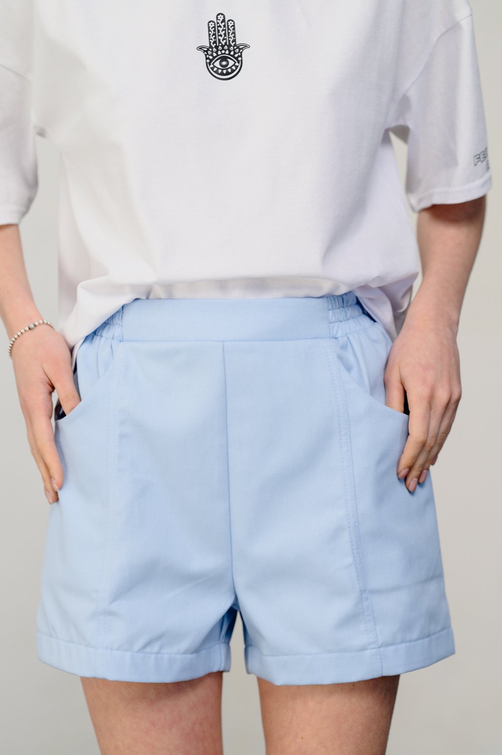 Light blue loose shorts with elastic waistband