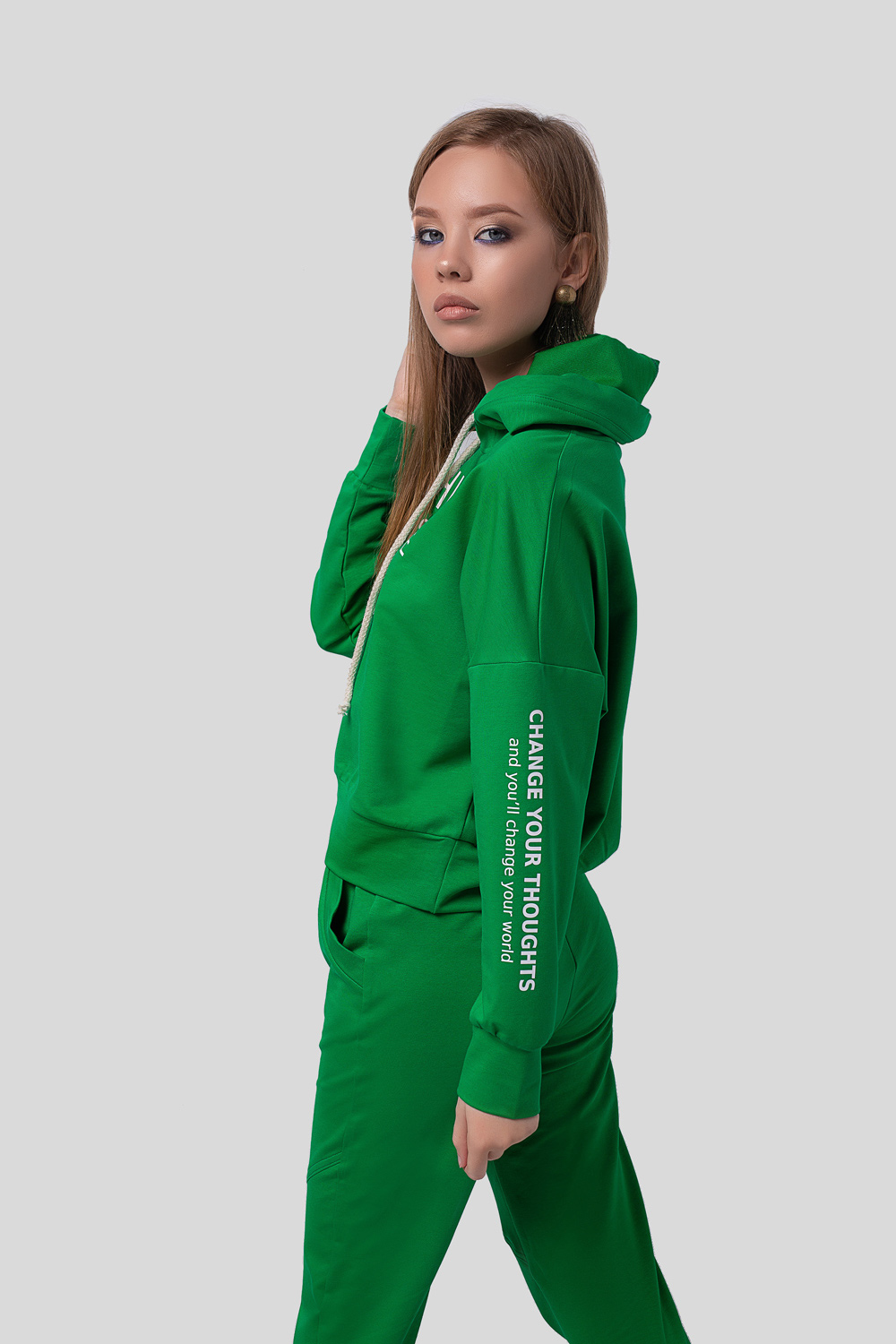 Green hoodie with a slogan