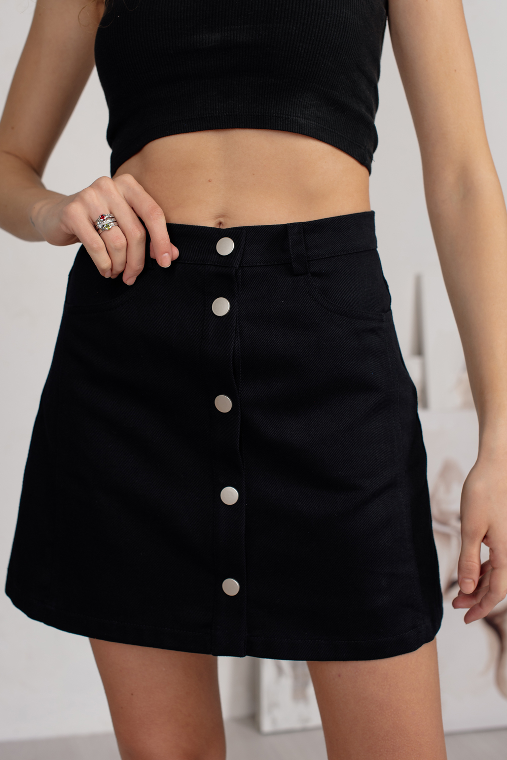 Black denim mini skirt