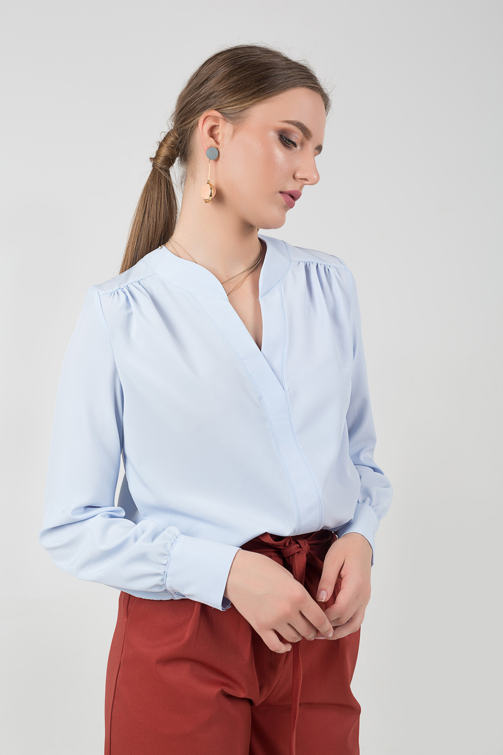 Blouse with a V-neck and assembly
