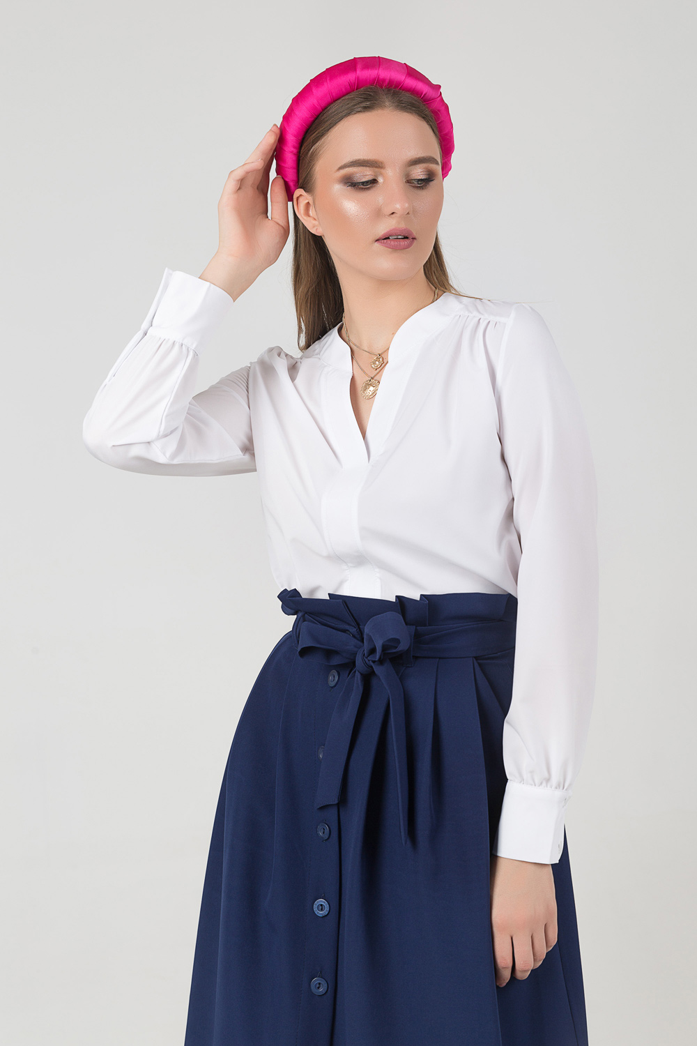 Blouse with a neckline and folds