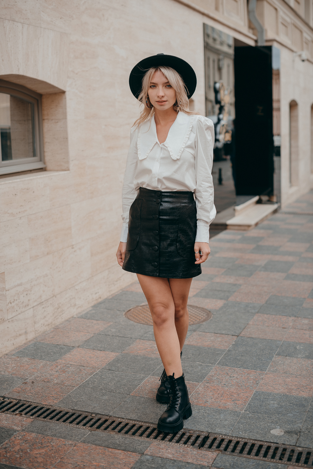 Black eco leather mini skirt with buttons