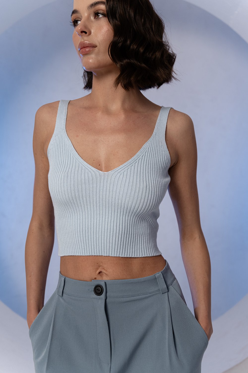 Light blue knitted top with low neckline
