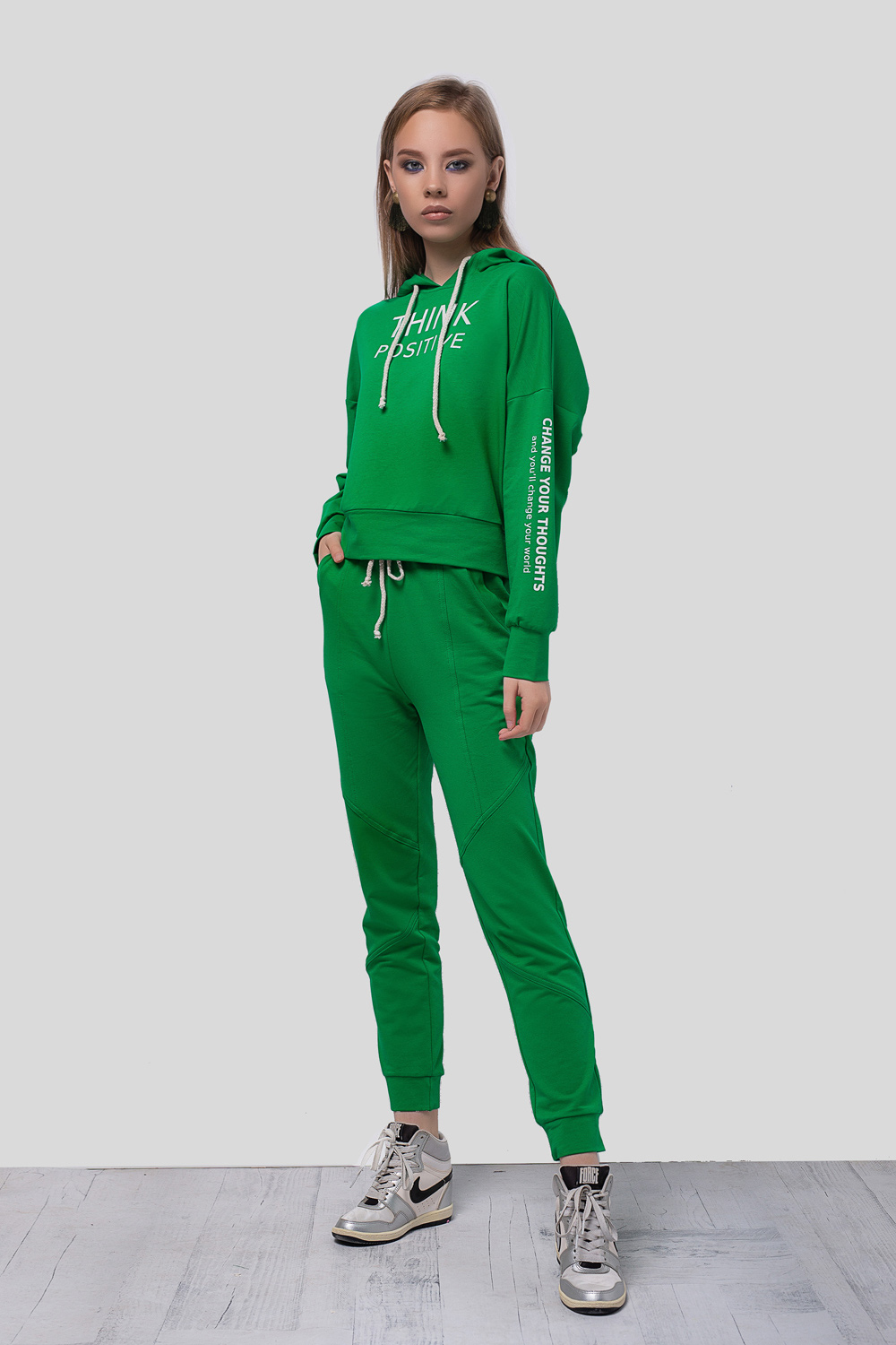 Green hoodie with a slogan