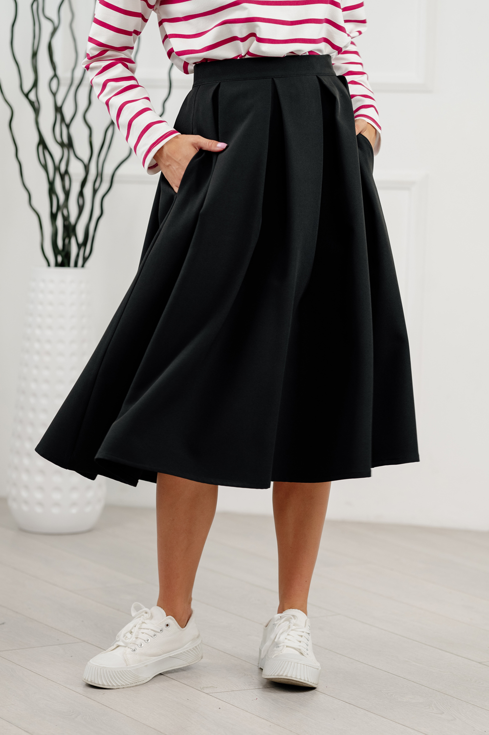 Black pleated below-the-knee skirt