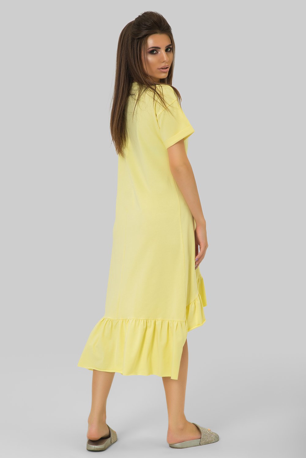 Yellow knitted dress with ruffle at the bottom