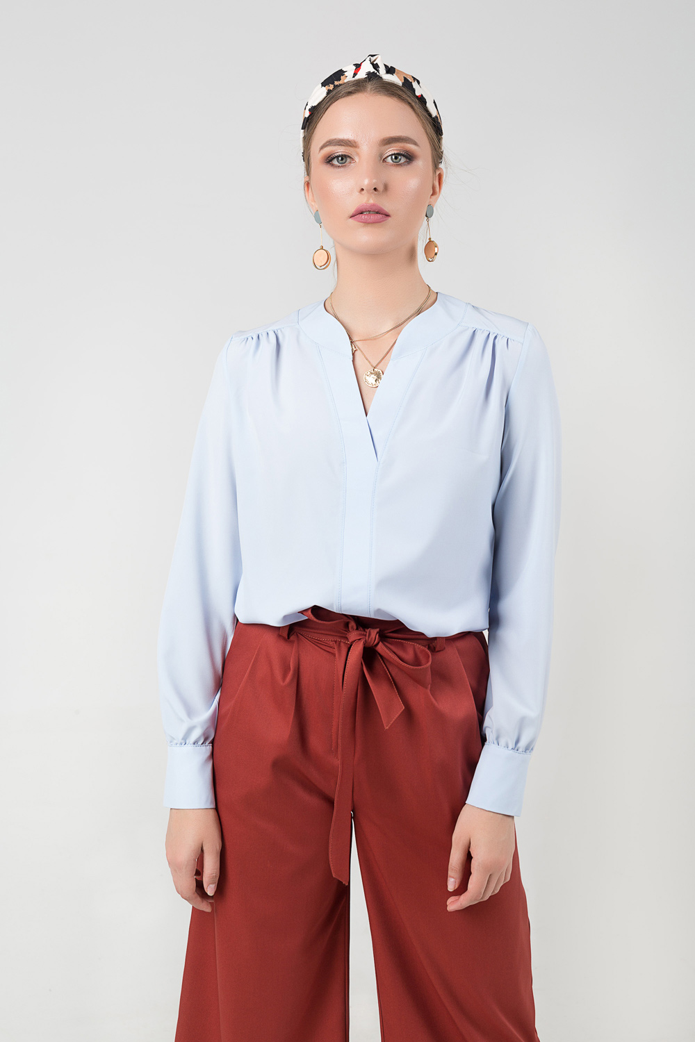Blouse with a V-neck and assembly