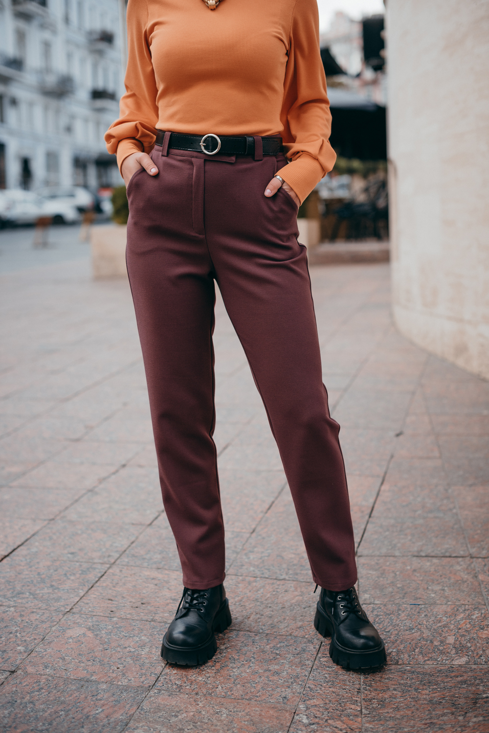 Trousers with beveled waistband and buttons