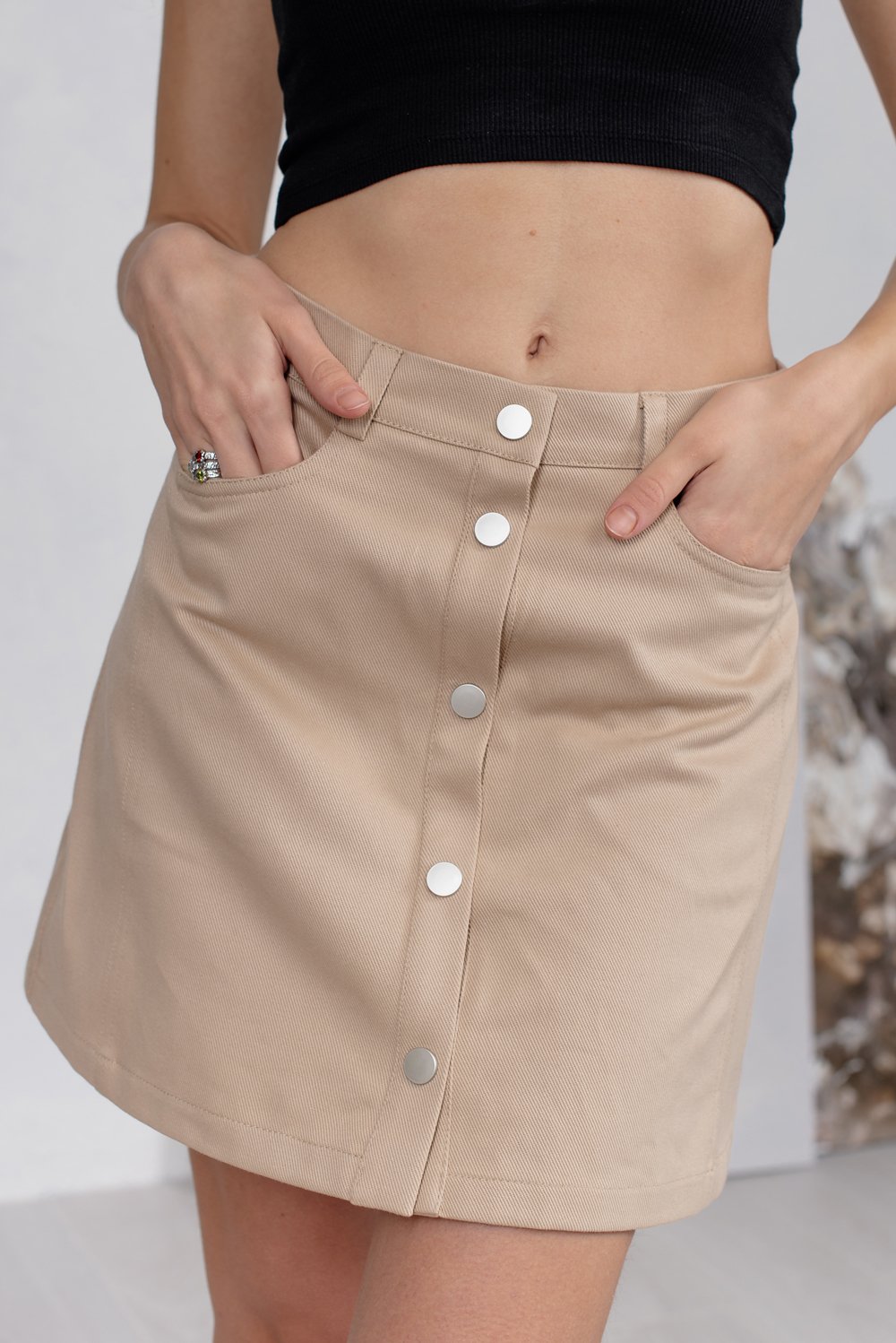 Beige mini skirt with pockets