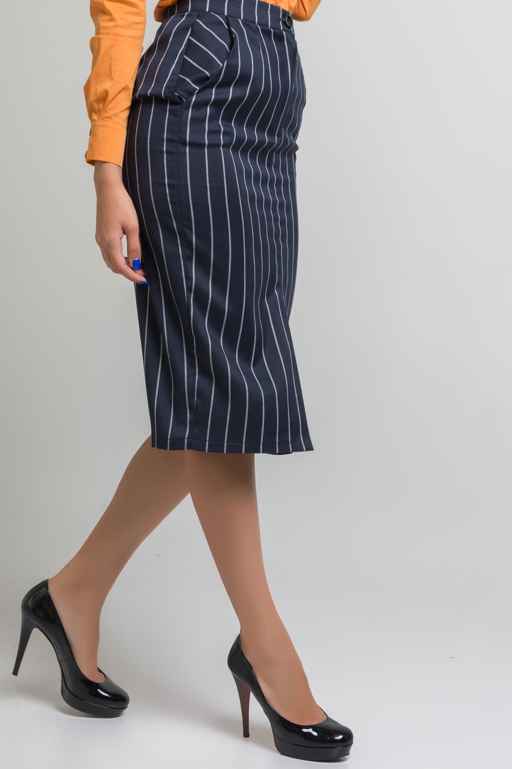 Midi length striped skirt with pockets and front cutout.