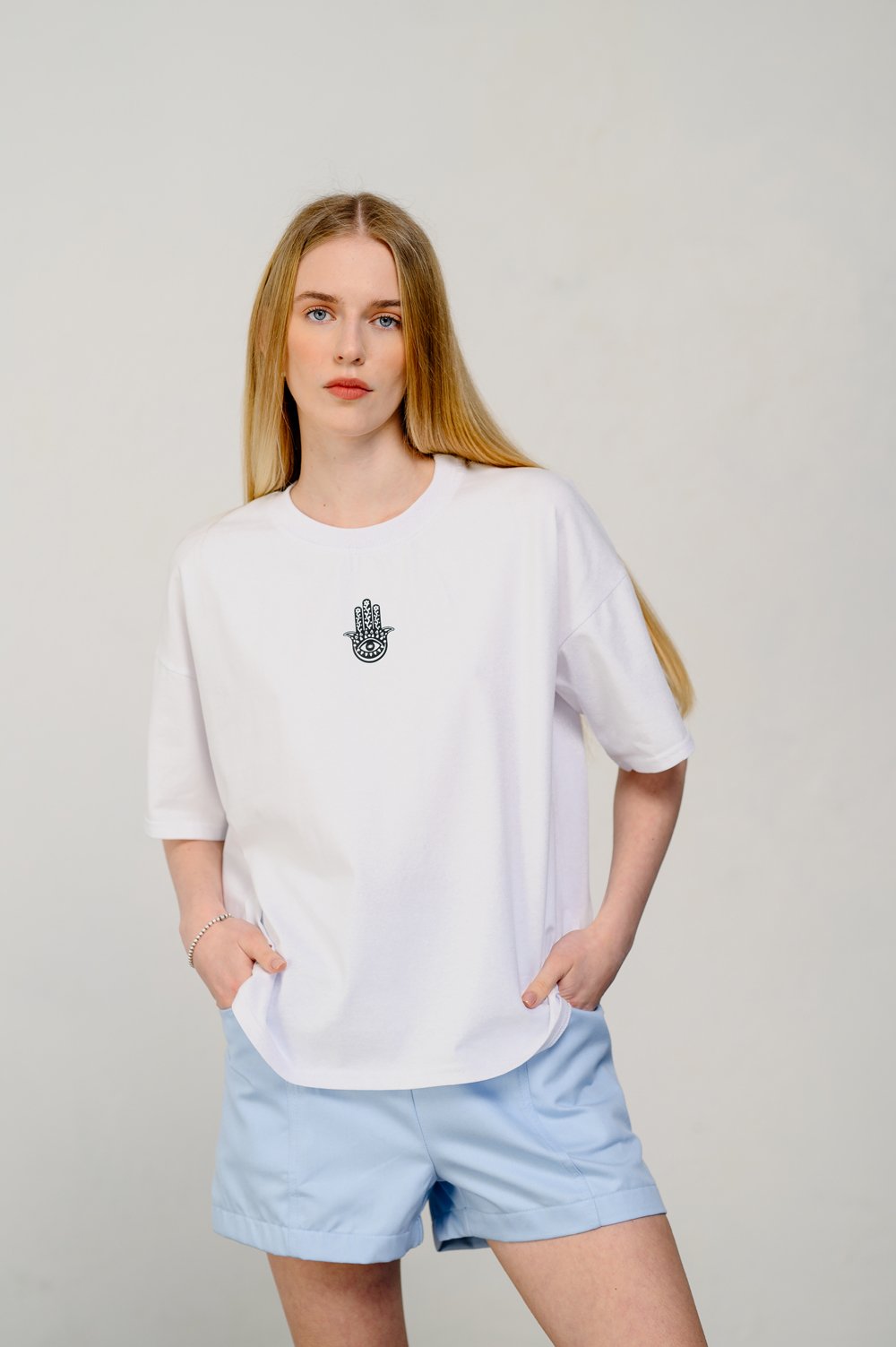 Oversized white T-shirt with sticker