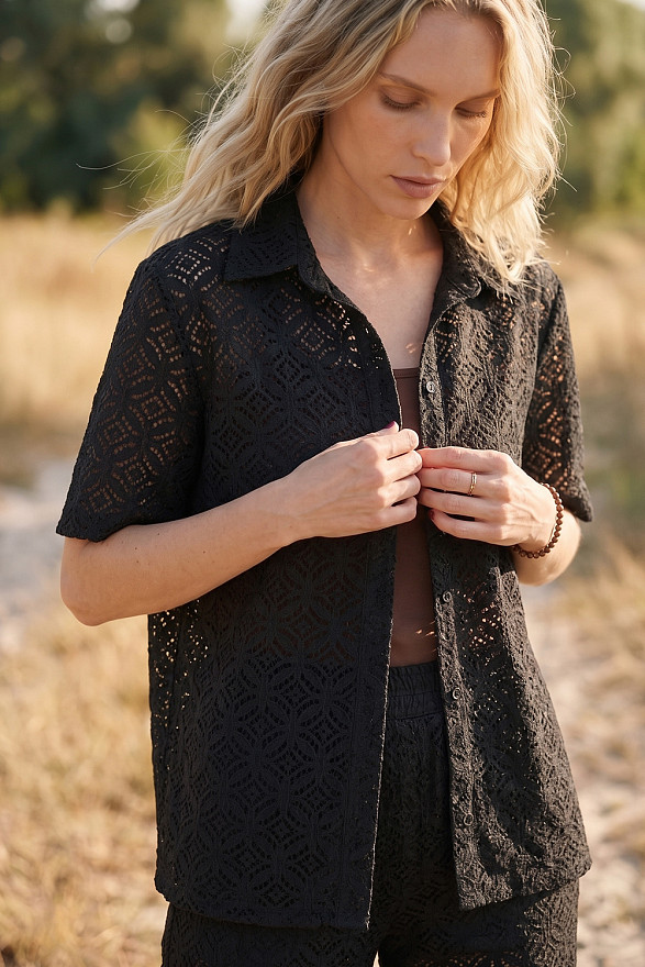 Black women's guipure suit