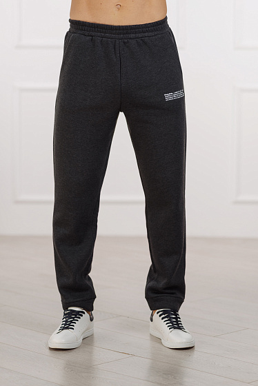 Warm sweatpants with soft fleece, side pockets, elasticated belt, stylish slogan on the side. The fabric is safe for health and has the international quality standard OEKO Tex 100
