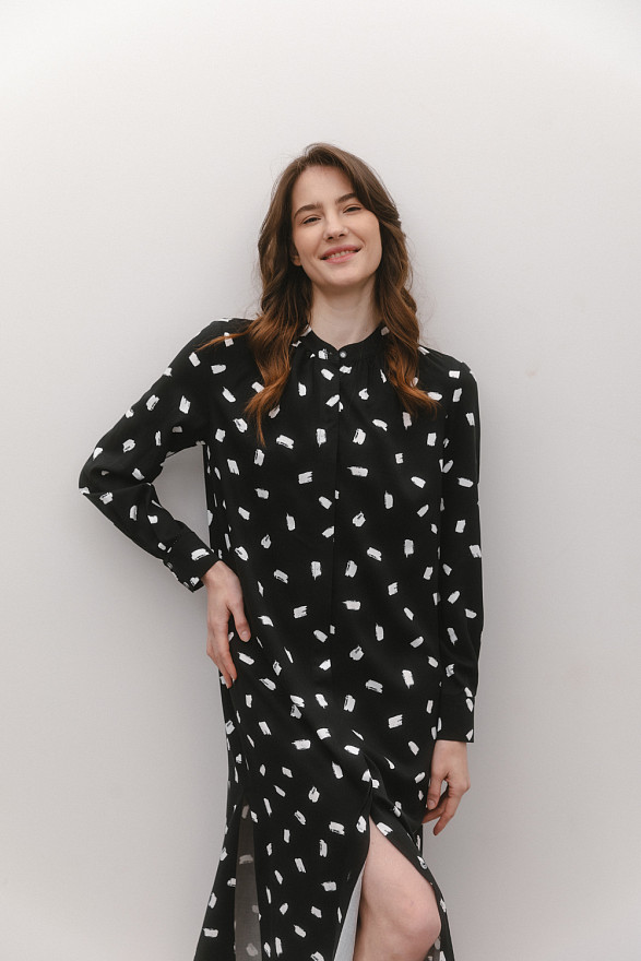 Black slip dress with slits at the side seams