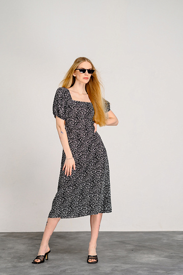 Charming semi-fitted midi dress with a figured cutout on the back at the waist is the perfect choice for stylish and self-confident women. Adjustable back width and puff sleeve height with elastic band provides a comfortable fit for any figure. In this dress you will look attractive and elegant.