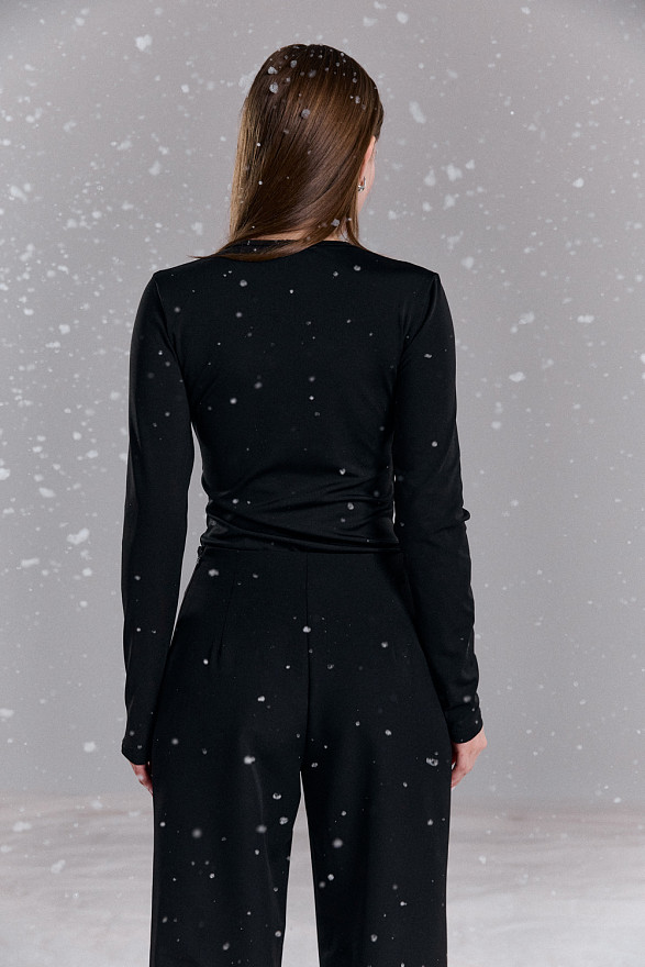 Black bodysuit with a shaped neckline made of mesh